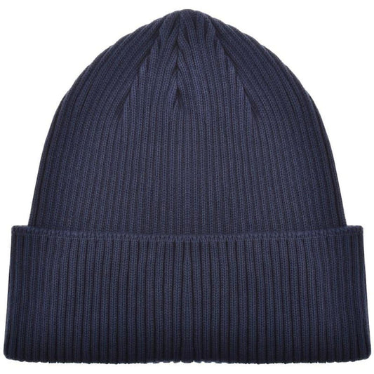CP Company navy blue beanie hat with goggle detail and cotton material.