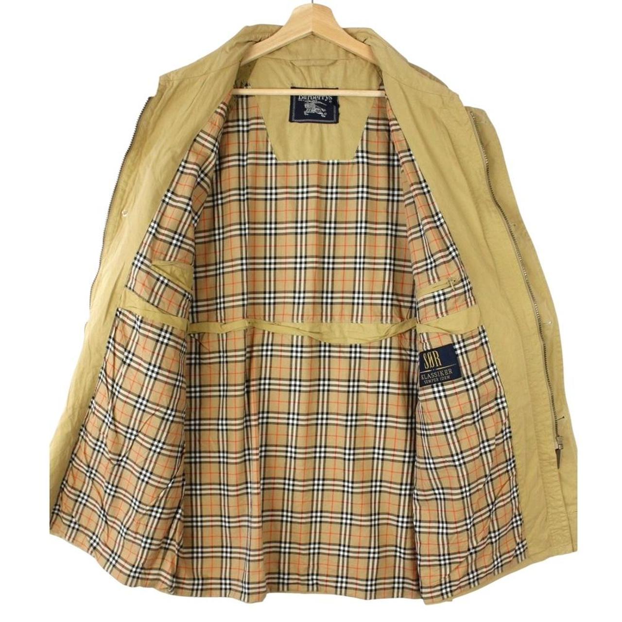 Burberry beige coat with Nova Check pattern, multi pockets, and cream lining.