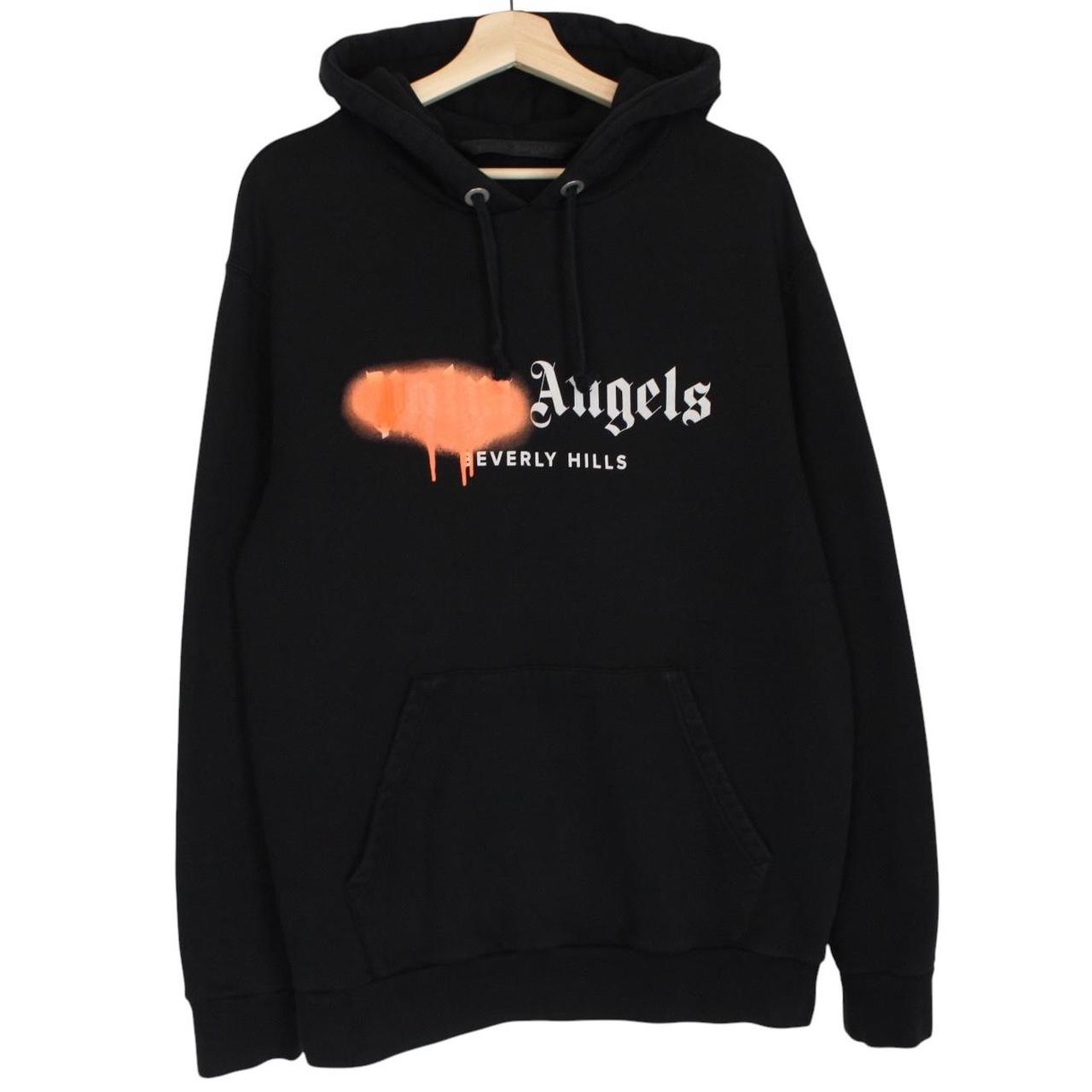 Palm Angels black and orange hoodie with Beverly Hills spray design and cotton material.