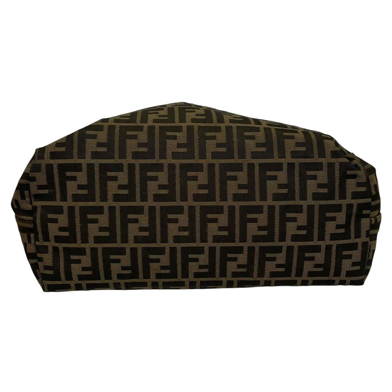 Fendi brown monogram canvas duffel bag with leather trim and logo detail.