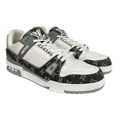 Louis Vuitton grey and white trainers with monogram pattern and leather accents.