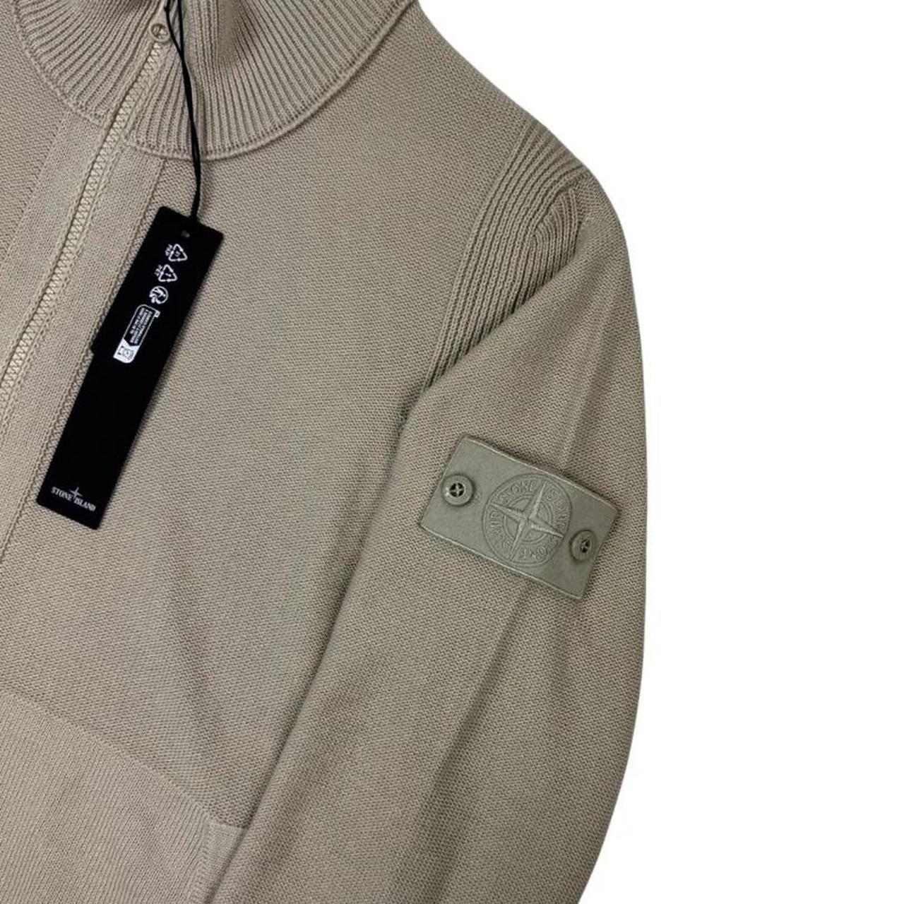 Stone Island beige knit jumper with stand collar, ribbed trims, and monochromatic badge.