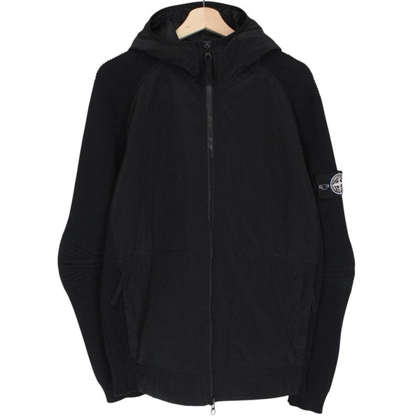 Stone Island black jacket with special process badge and full zip design.