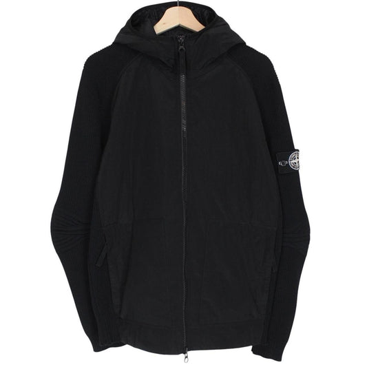 Stone Island black jacket with special process badge and full zip design.