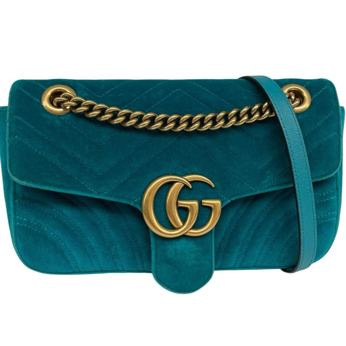 Gucci turquoise velvet shoulder bag with gold GG logo and green accents.