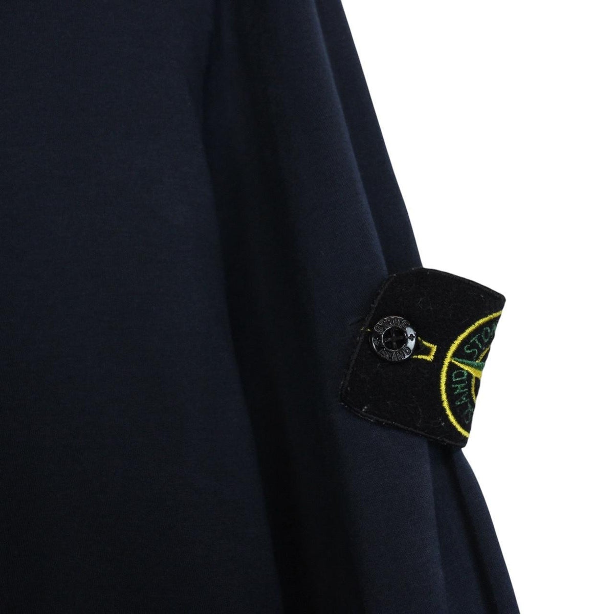 Stone Island navy blue long sleeve polo shirt with iconic compass logo on chest.