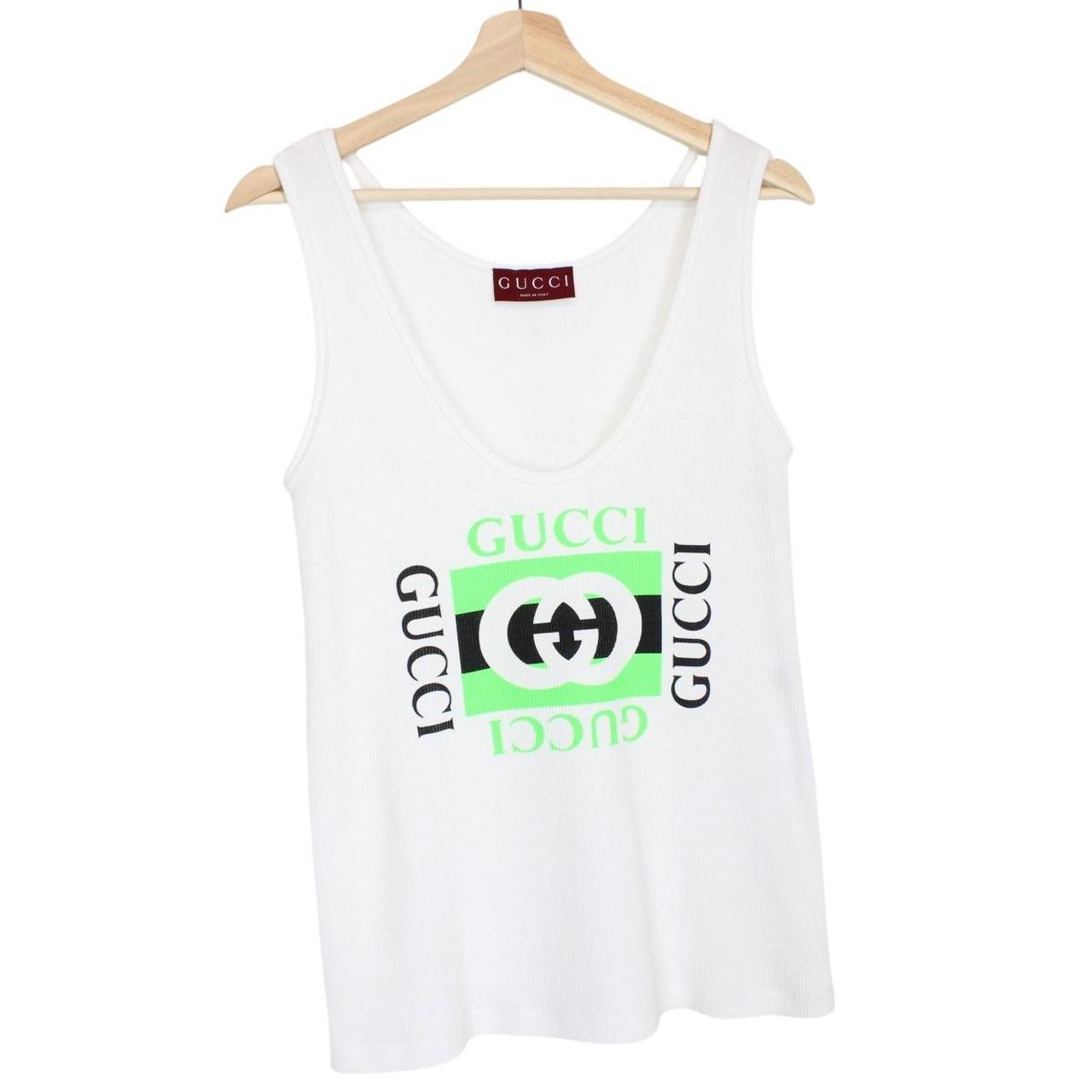 Gucci white tank top featuring bold logo print on soft cotton material.