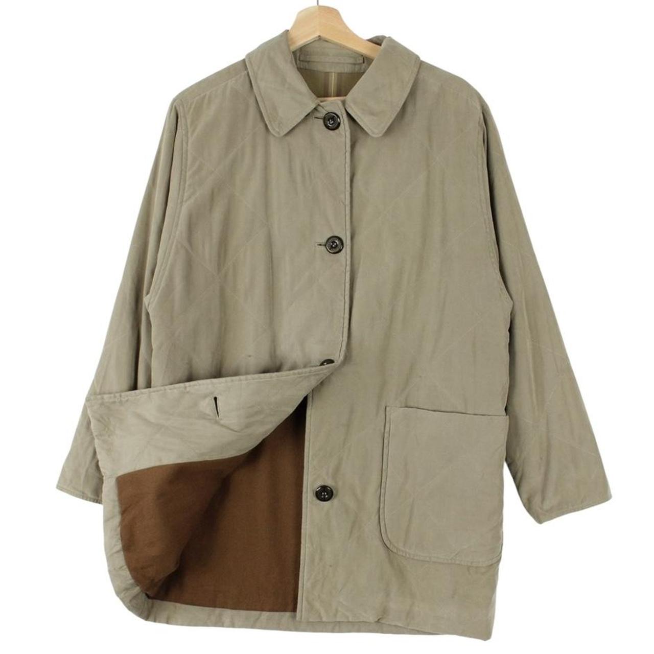 Burberry khaki green quilted coat with wool lining and classic logo detail.