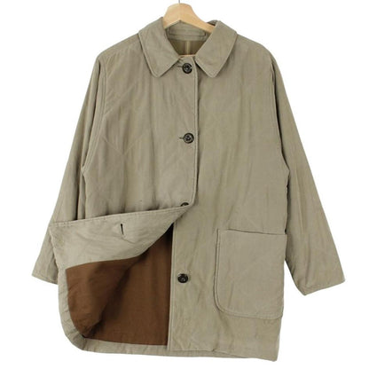 Burberry khaki green quilted coat with wool lining and classic logo detail.