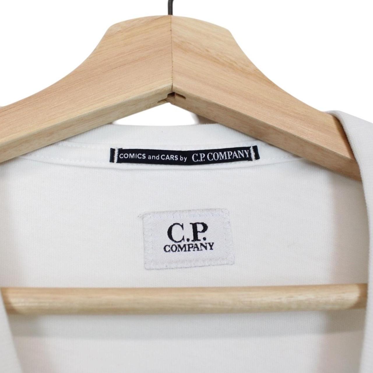 CP Company black and white comic print cotton t-shirt with pocket detail.