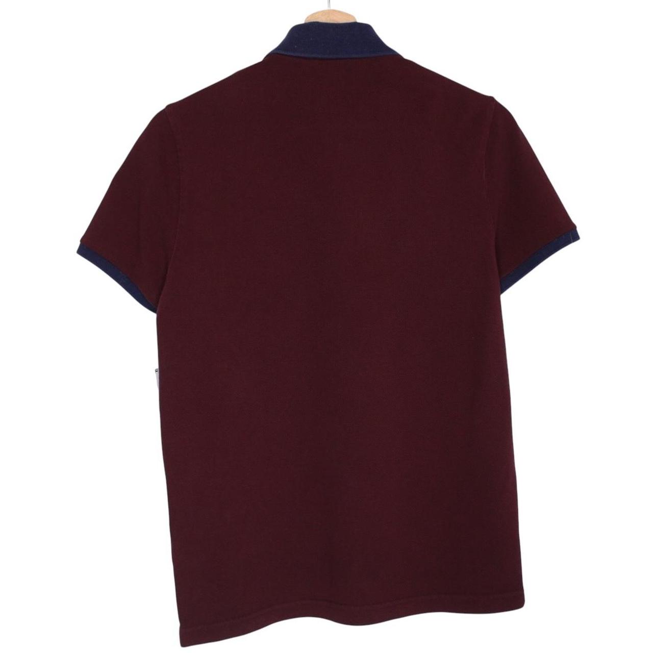 Moncler burgundy short sleeve polo shirt with logo detail and cotton material.