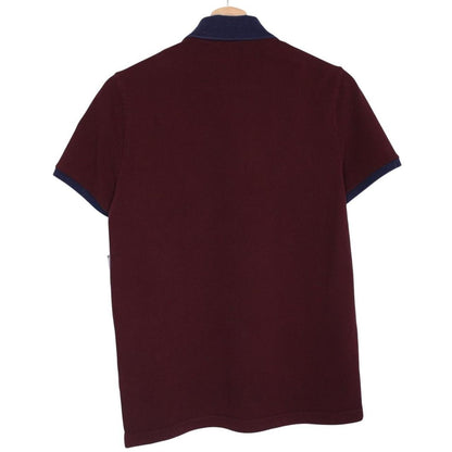 Moncler burgundy short sleeve polo shirt with logo detail and cotton material.