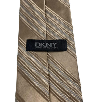 DKNY gold silk tie with vertical stripes and logo detail.