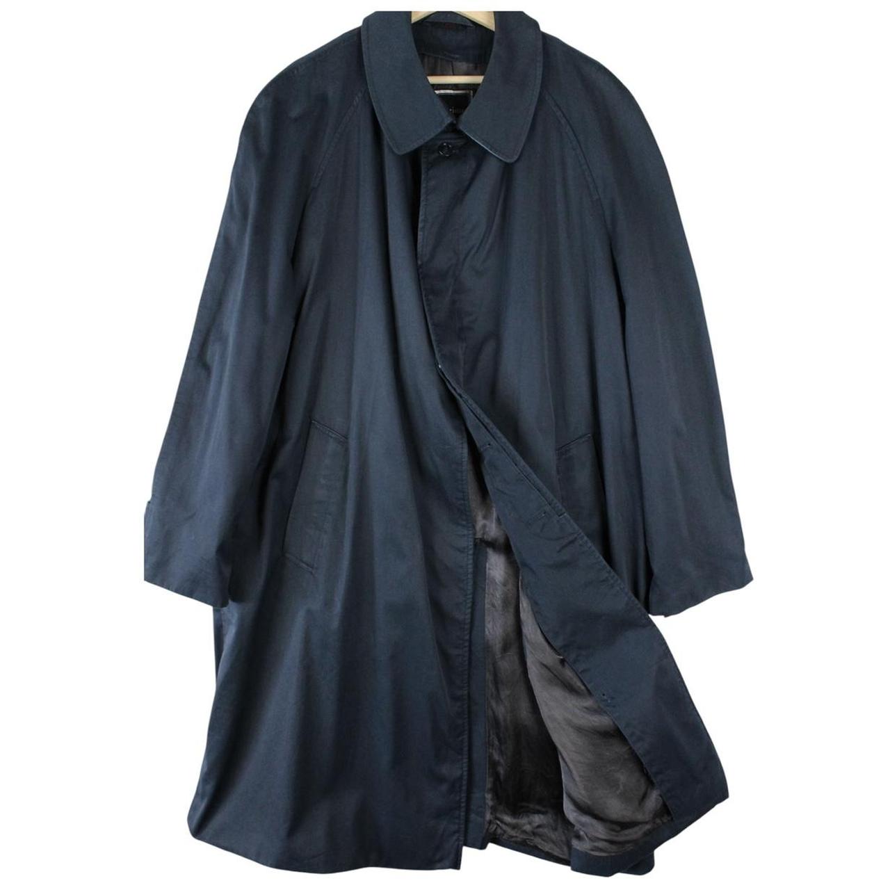 Christian Dior navy blue trench coat, single-breasted, vintage 90s style, classic design.