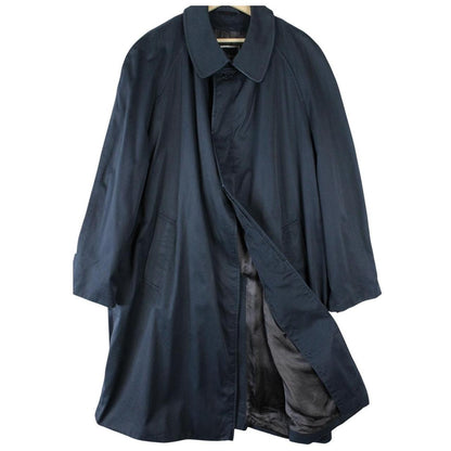Christian Dior navy blue trench coat, single-breasted, vintage 90s style, classic design.