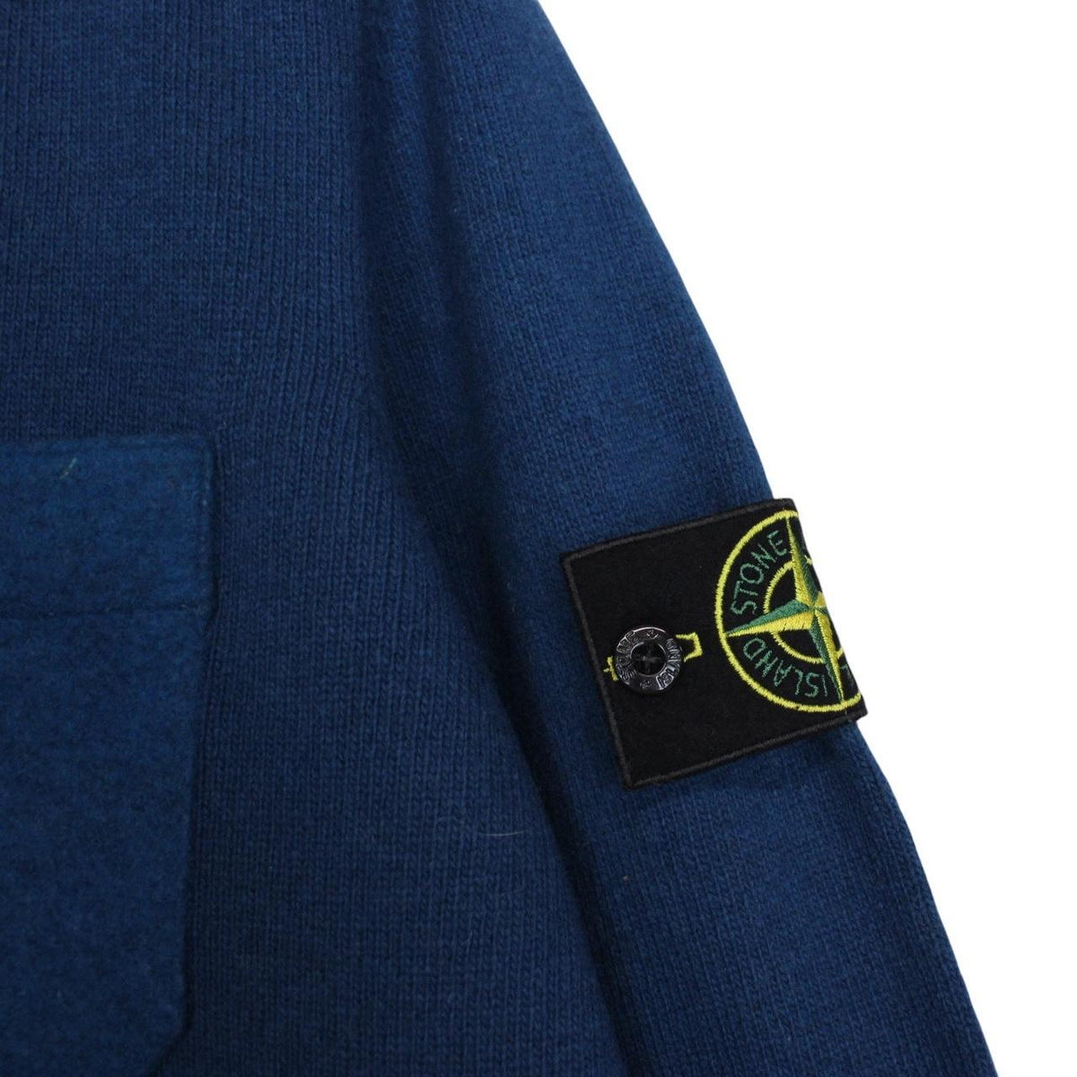 Stone Island blue wool knit jumper with logo patch and ribbed cuffs.