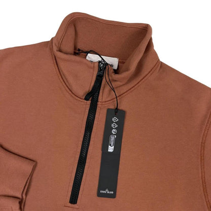 Stone Island orange jumper with 1/4 zip, logo patch on sleeve, organic cotton.