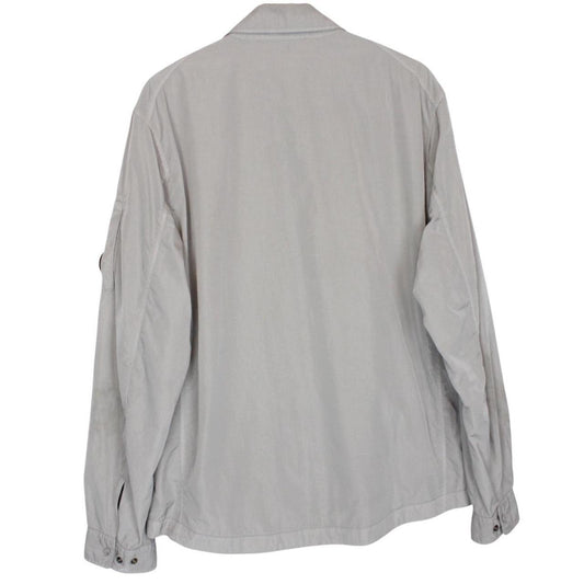 CP Company grey overshirt jacket with lens detail and garment dyed nylon fabric.