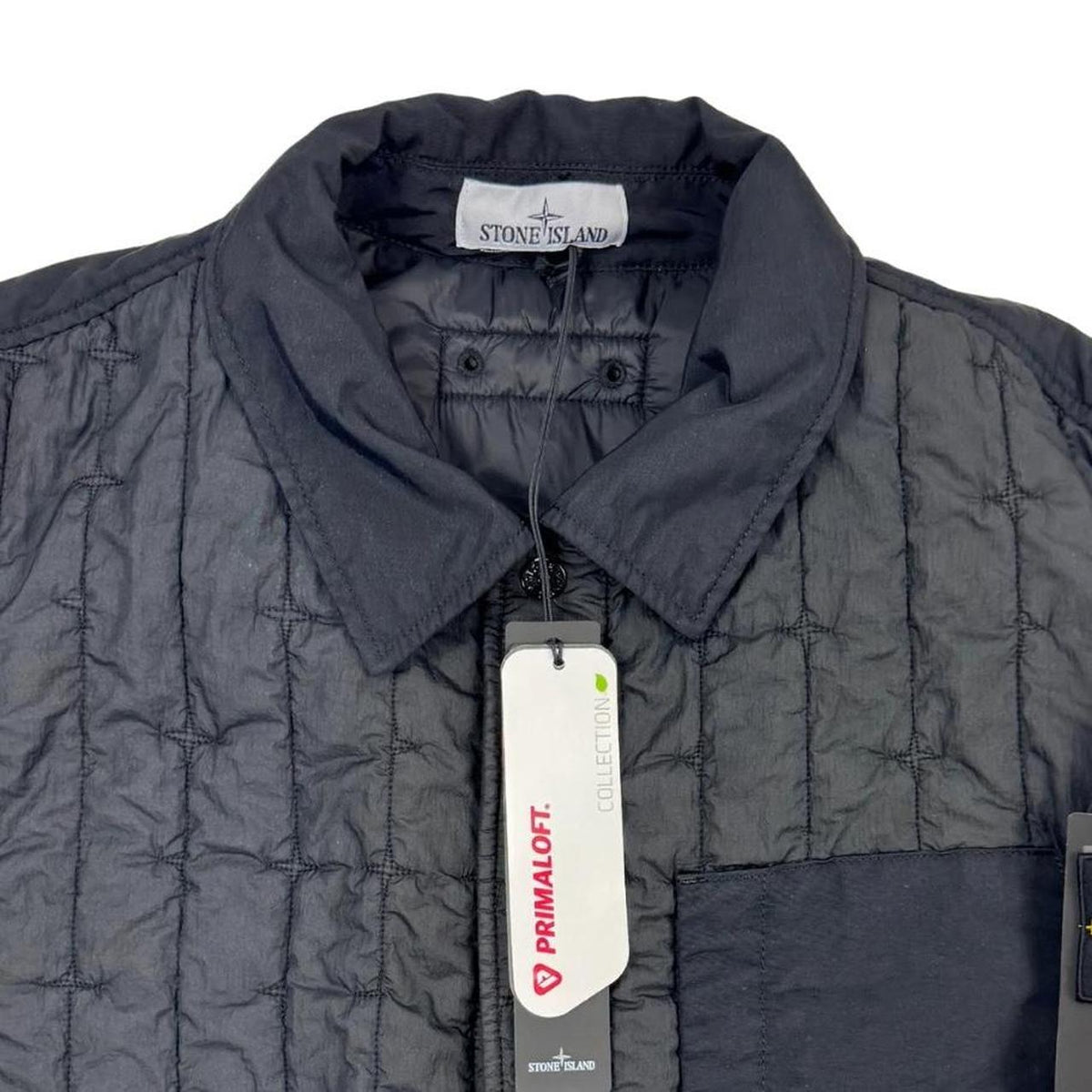 Stone Island black quilted nylon jacket with logo badge and Primaloft-TC material.