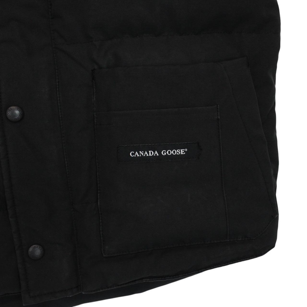 Canada Goose black down gilet with logo patch and original tags, very good condition.