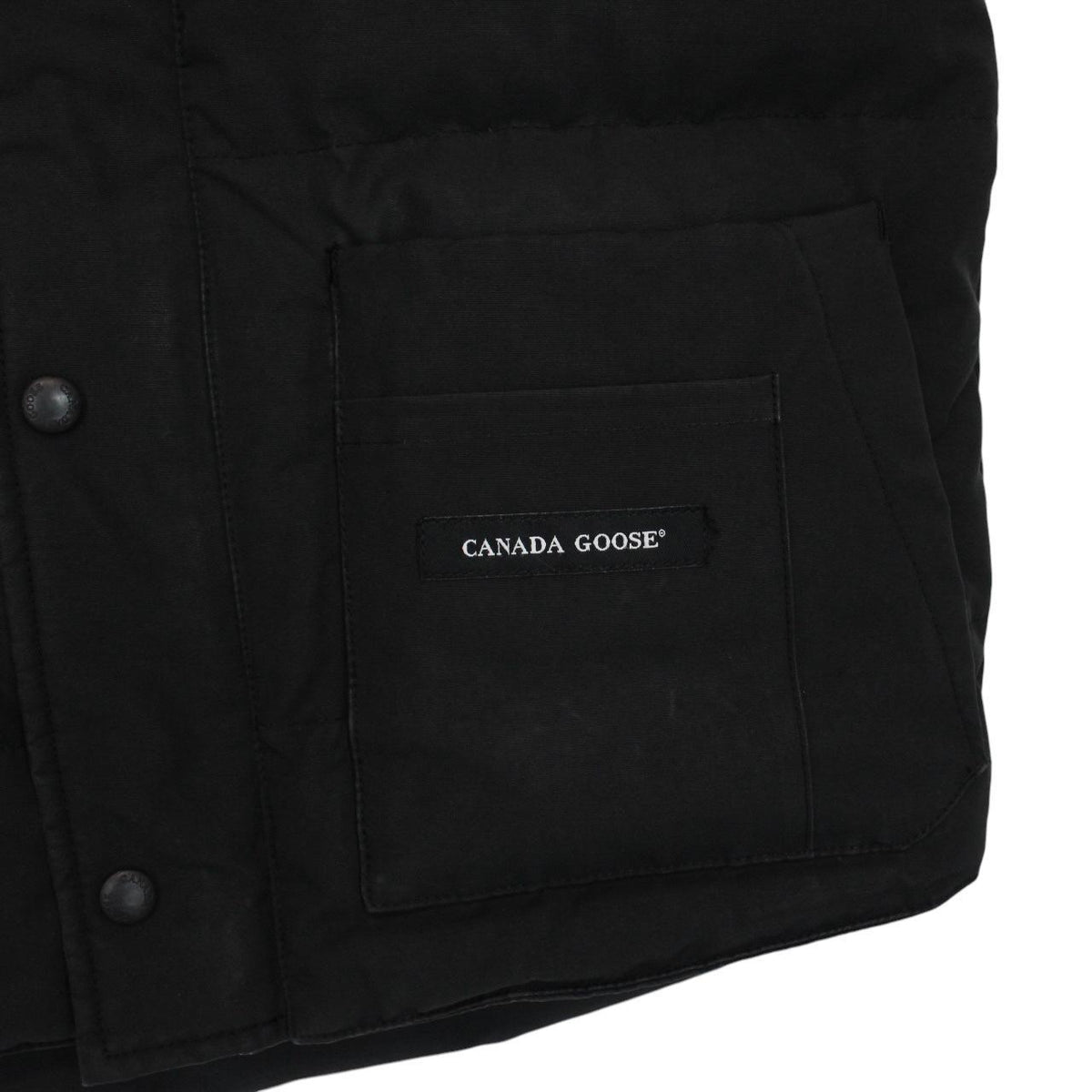 Canada Goose black down gilet with logo patch and original tags, very good condition.