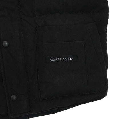 Canada Goose black down gilet with logo patch and original tags, very good condition.