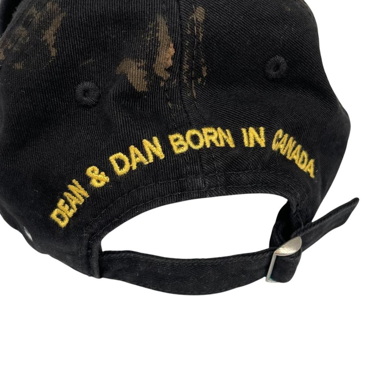 Dsquared2 black and red baseball cap embroidered Brothers logo on front.