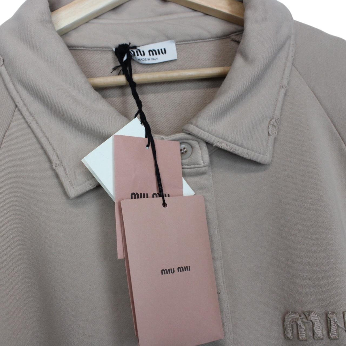 Miu Miu beige cotton polo sweatshirt with embroidered logo, oversized fit, brand new with tags.