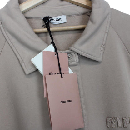 Miu Miu beige cotton polo sweatshirt with embroidered logo, oversized fit, brand new with tags.