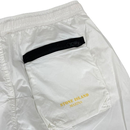 Stone Island white and yellow trousers with logo patch and RE-T fit design.