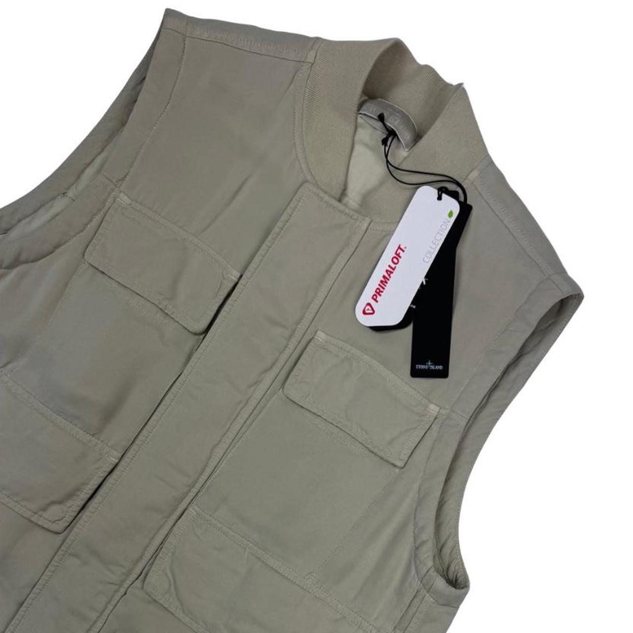 Stone Island beige vest jacket with logo patch and Primaloft material.