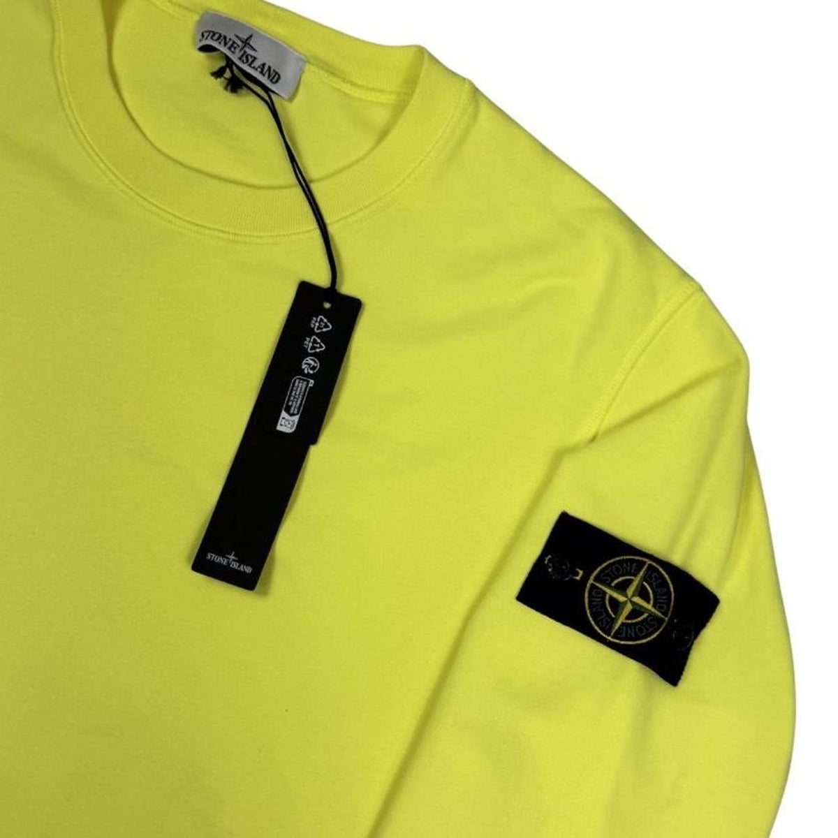 Stone Island yellow sweatshirt made from organic cotton with logo patch on sleeve.