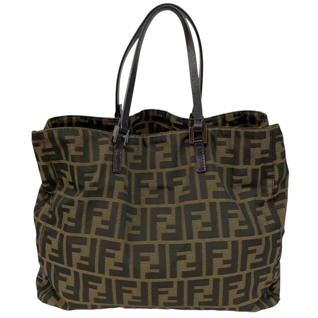 Fendi brown duffel bag featuring iconic Zucca monogram canvas and leather handles.