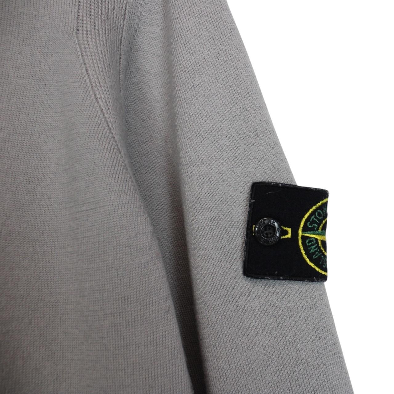 Stone Island grey wool knit jumper with logo patch and subtle wear marks.
