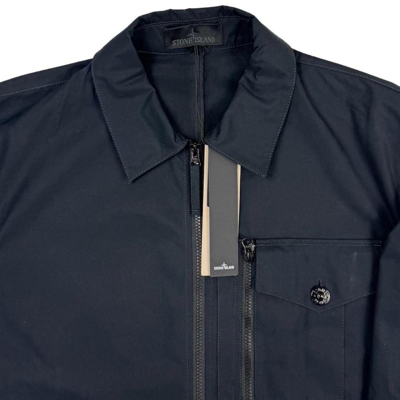 Stone Island navy blue waterproof overshirt jacket with ghost logo and cotton material.