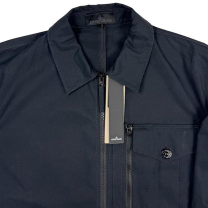 Stone Island navy blue waterproof overshirt jacket with ghost logo and cotton material.