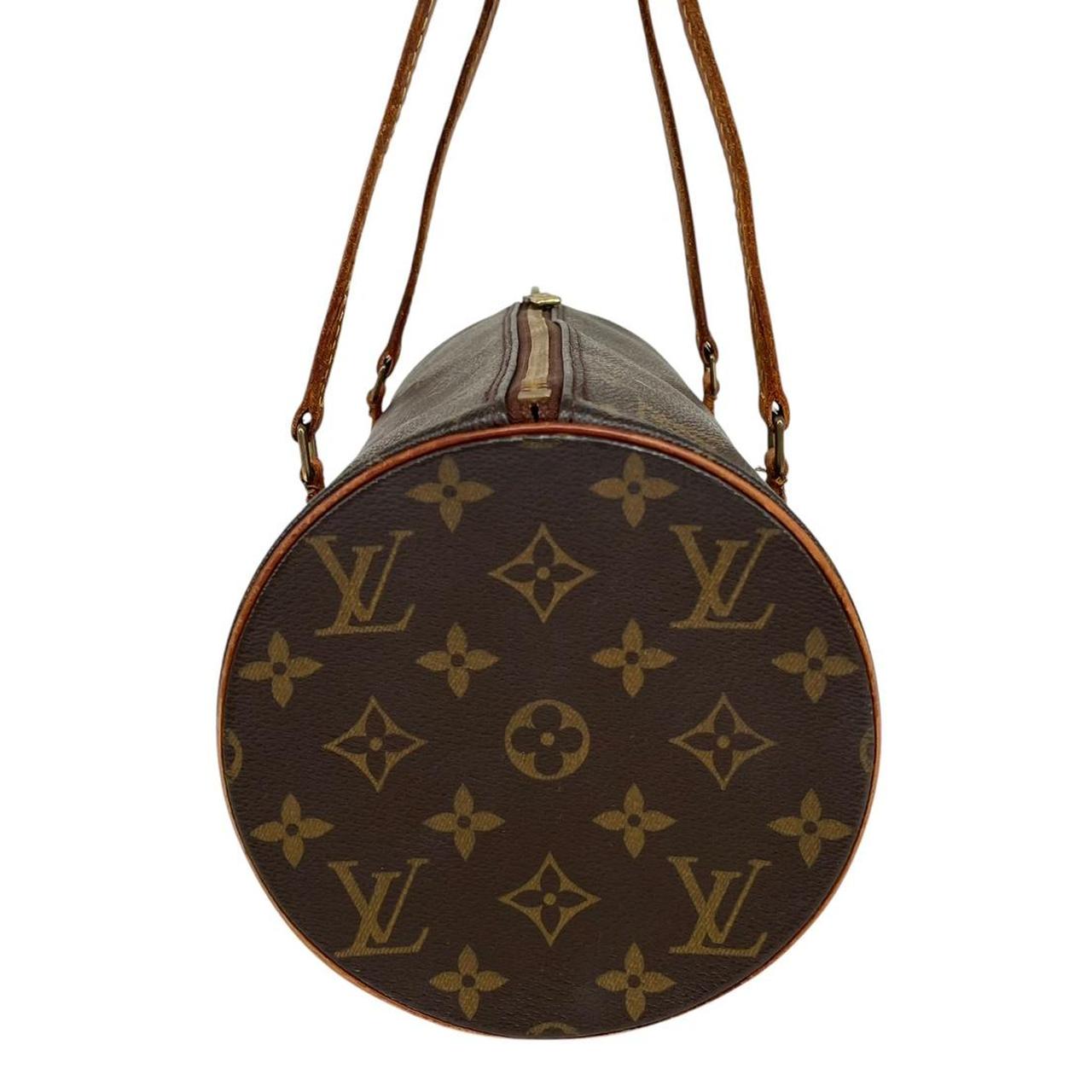 Louis Vuitton duffel bag brown and tan monogram canvas with logo and piping details.