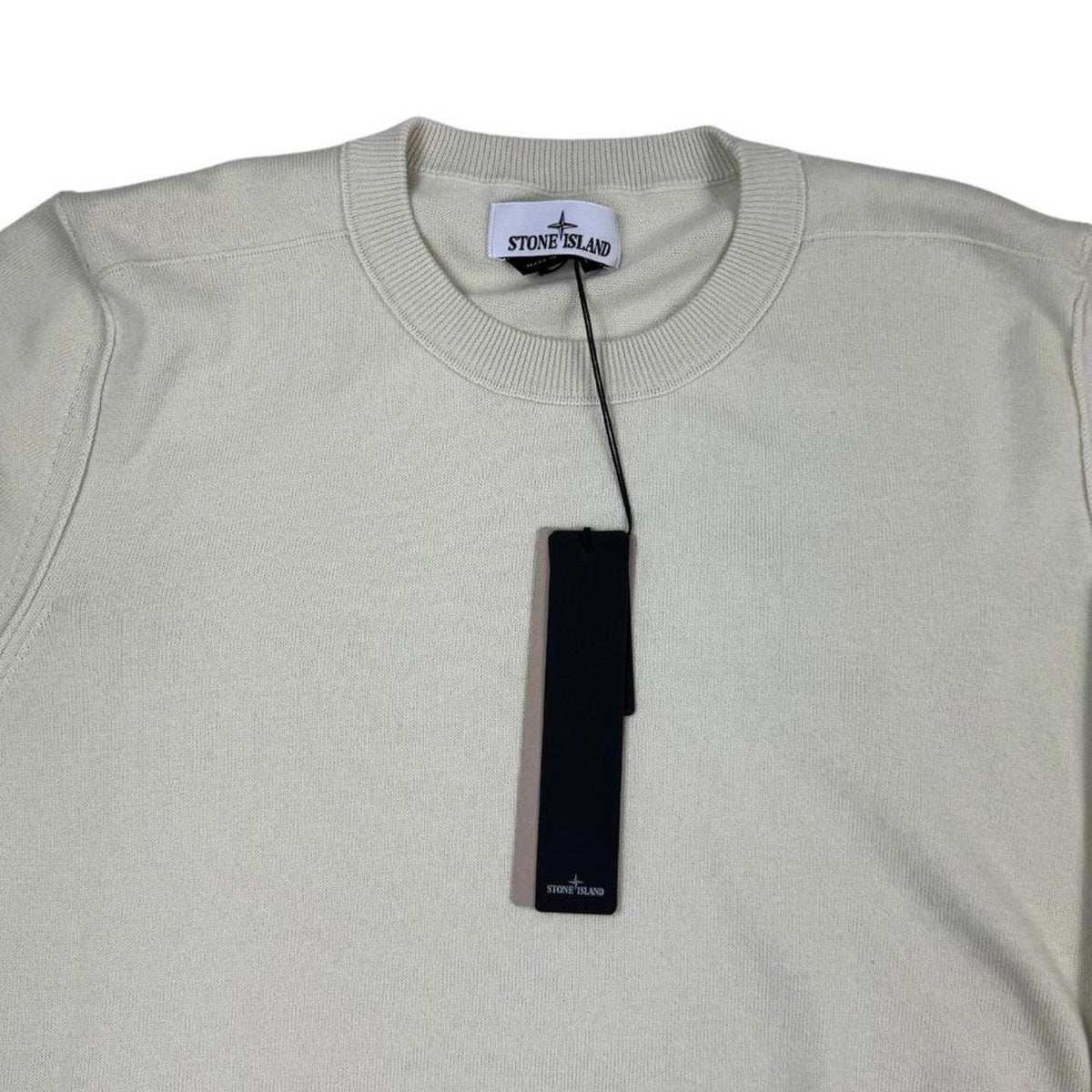 Stone Island beige knit jumper made from organic cotton with logo badge detail.