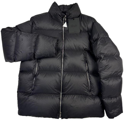Moncler black nylon down puffer jacket with logo patch and quilted design.