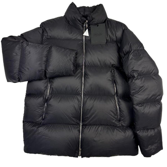 Moncler black nylon down puffer jacket with logo patch and quilted design.