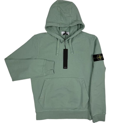 Stone Island green cotton hoodie with logo patch and drawstring hood.
