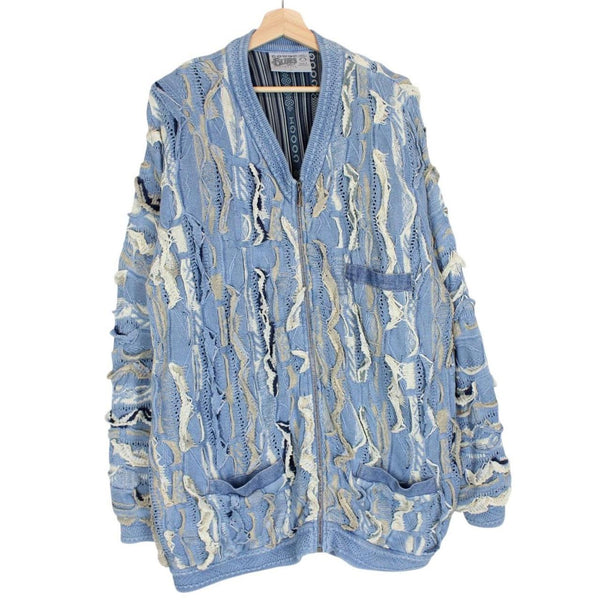Coogi blue cotton knit full zip cardigan with signature colorful pattern and logo.
