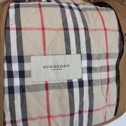 Burberry tan brown diamond quilted jacket with Nova Check lining and logo detail.