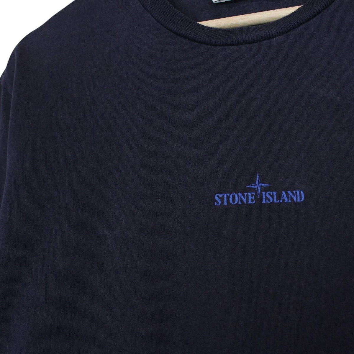 Stone Island navy blue short sleeve cotton t-shirt with logo print and label detail.