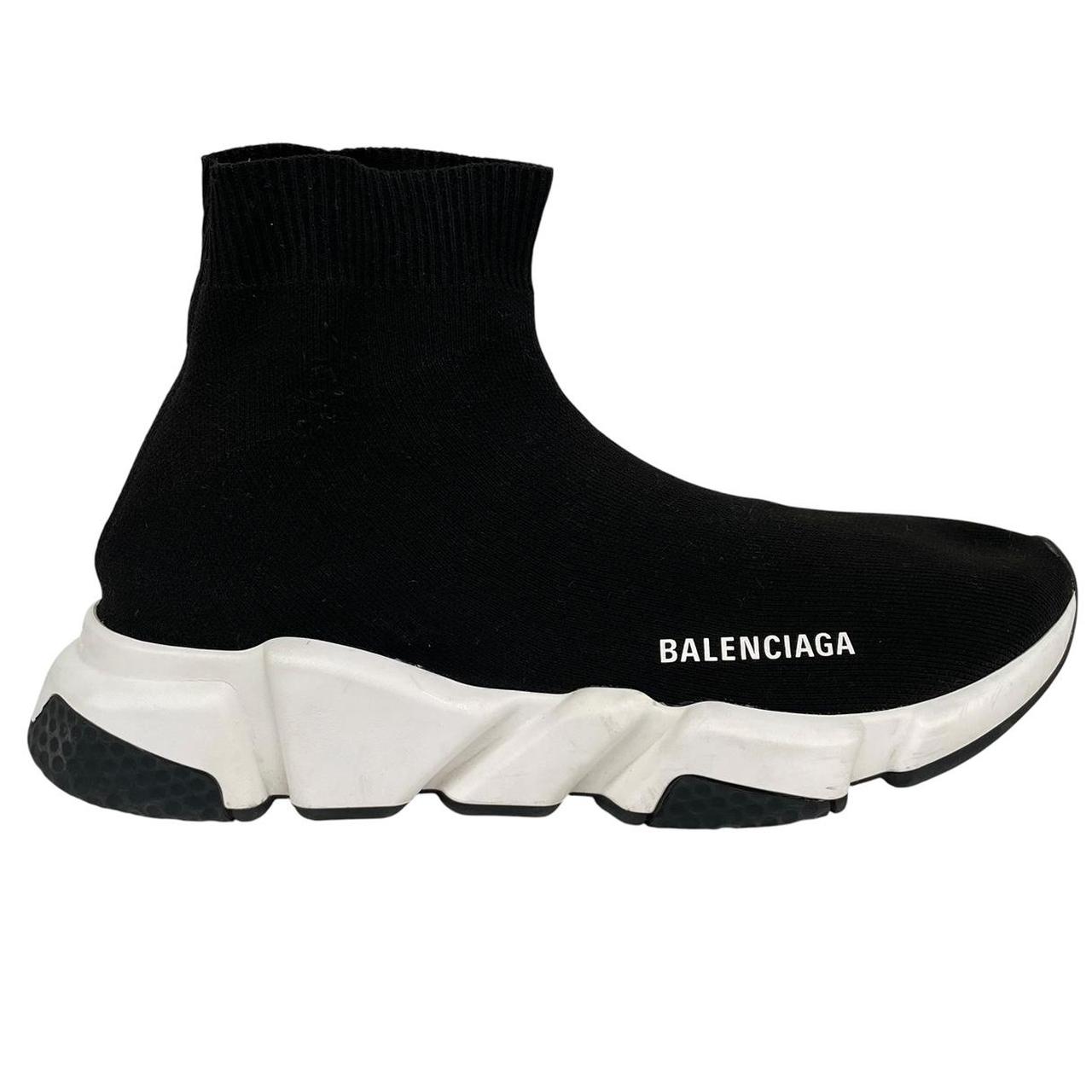 Balenciaga Speed 2 black and white trainers with logo detailing and cotton material.