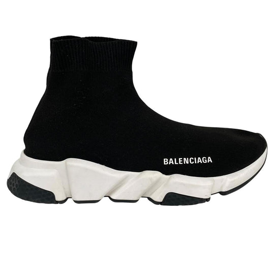 Balenciaga Speed 2 black and white trainers with logo detailing and cotton material.