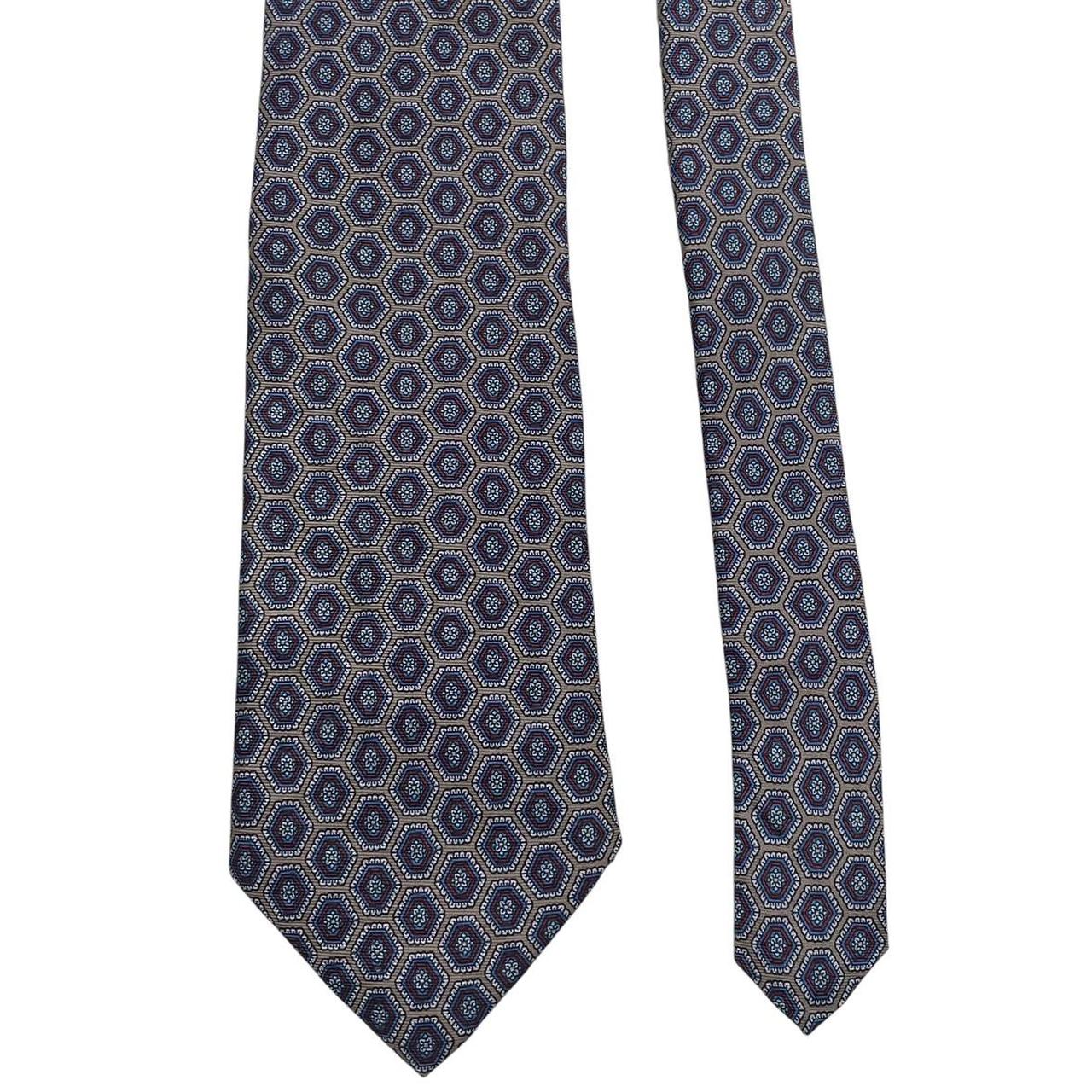 Aquascutum blue and grey silk tie with geometric print pattern.