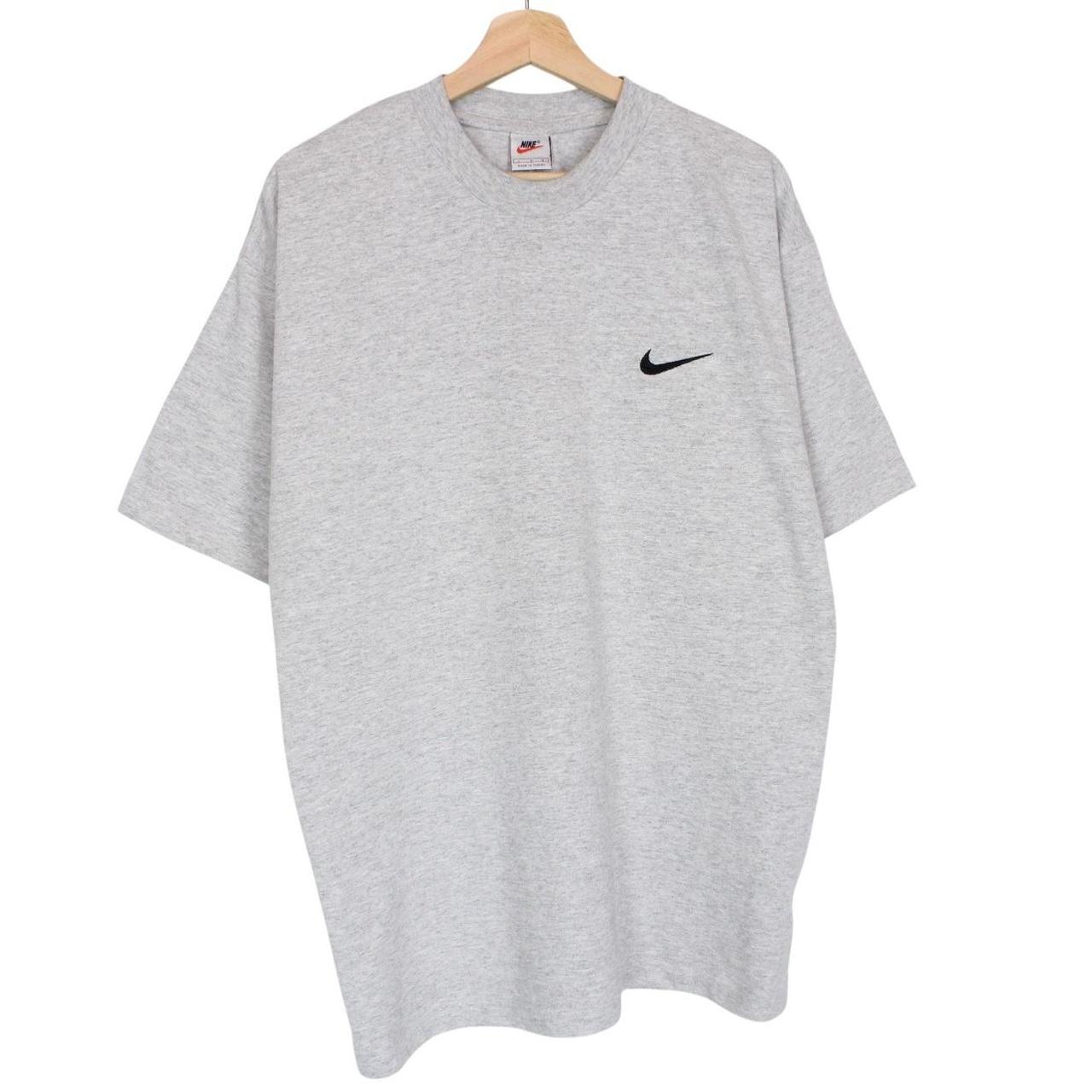 Nike grey short sleeve cotton t-shirt with pocket and vintage logo detail.