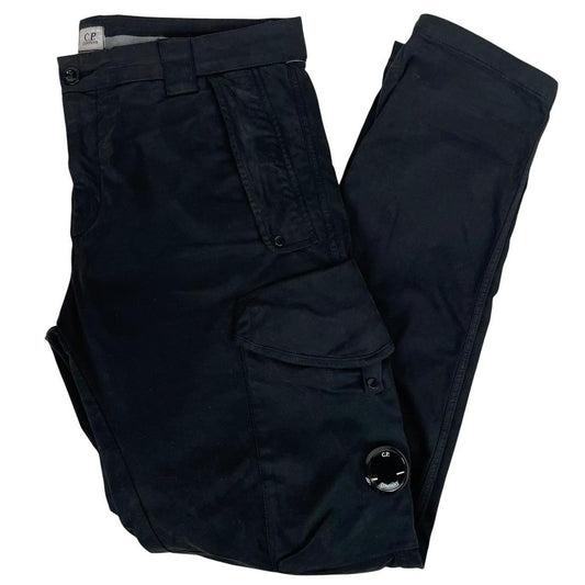 CP Company navy blue tapered fit cargo trousers with lens detail and pockets.