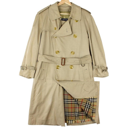 Burberry beige trench coat with Nova Check pattern, double-breasted and belted design.